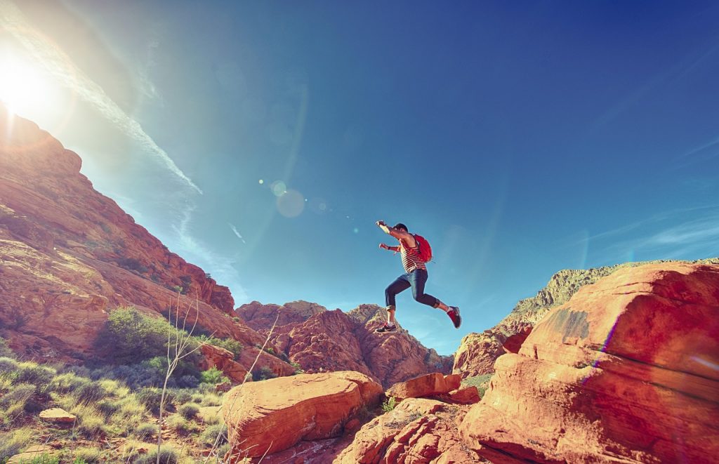 man, jumping, mountains, rock formations, jump, joyful, happy, athletic, outdoors, fun, sport, hiking, rocks, national, park, sunlight, nature, action, active